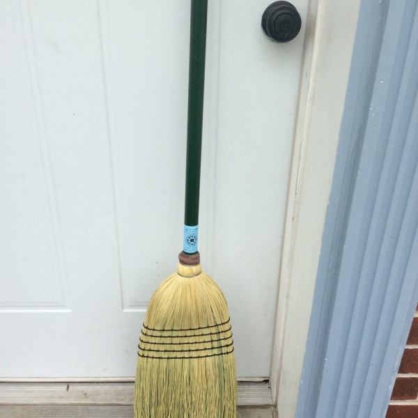 Heavy outdoor broom with green painted handle